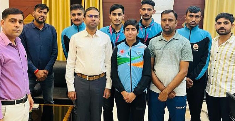 National Games medal winners meet collector