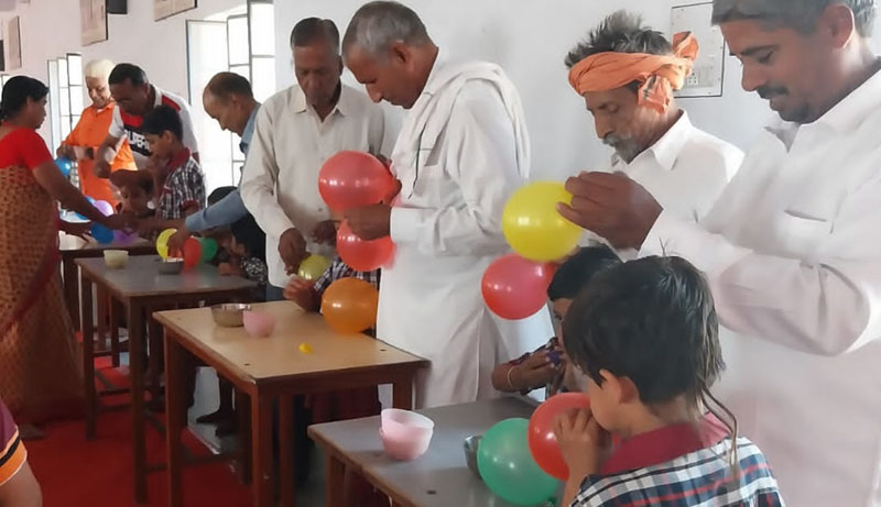 Grandparents played balloon blowing competition with grandchildren