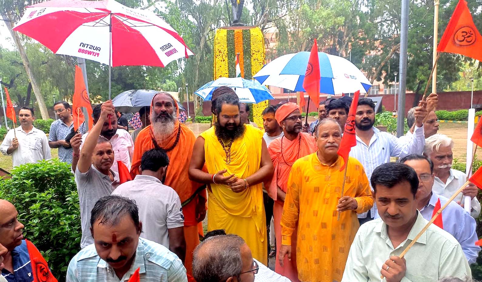 Saints staged a silent protest at the Collectorate against the persecution of Hindus in Bangladesh